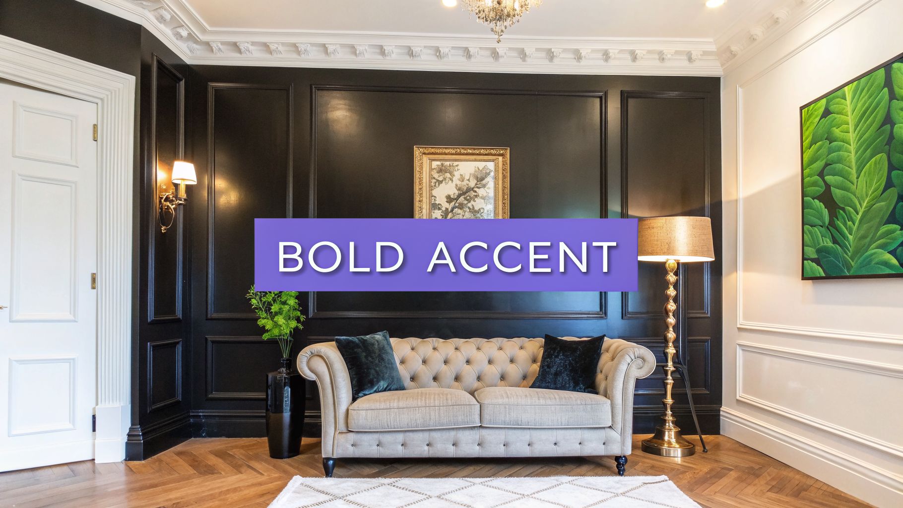 A stylish living room features black paneled walls, a tufted cream sofa, and vibrant green artwork.