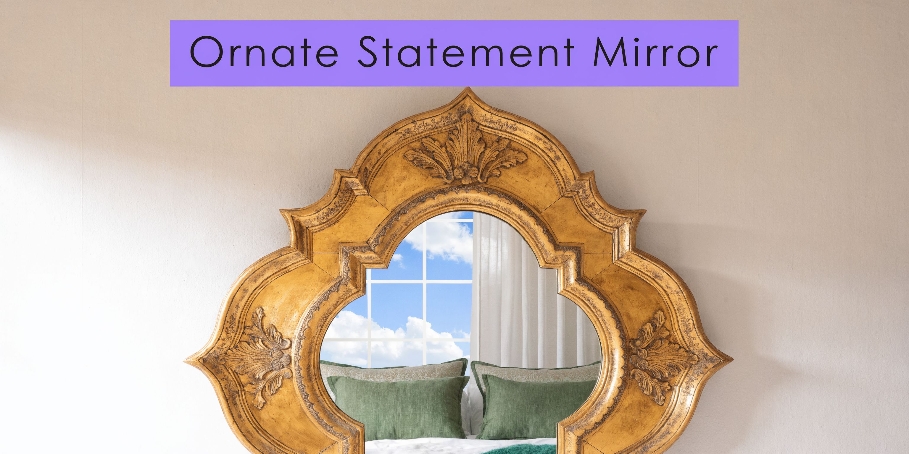 An ornate gold statement mirror with a uniquely shaped frame hangs on a plain wall.