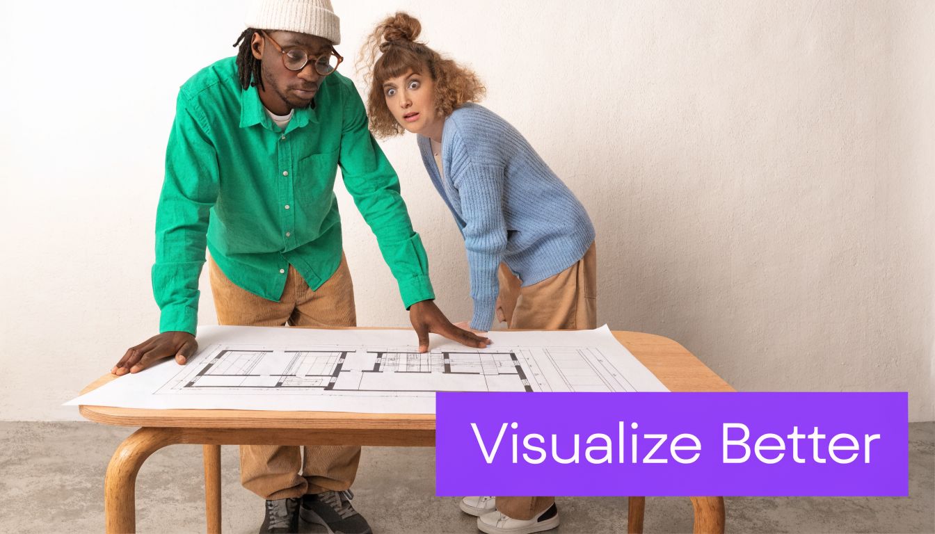 A man and woman looking intently at architectural floor plans laid out on a wooden table.
